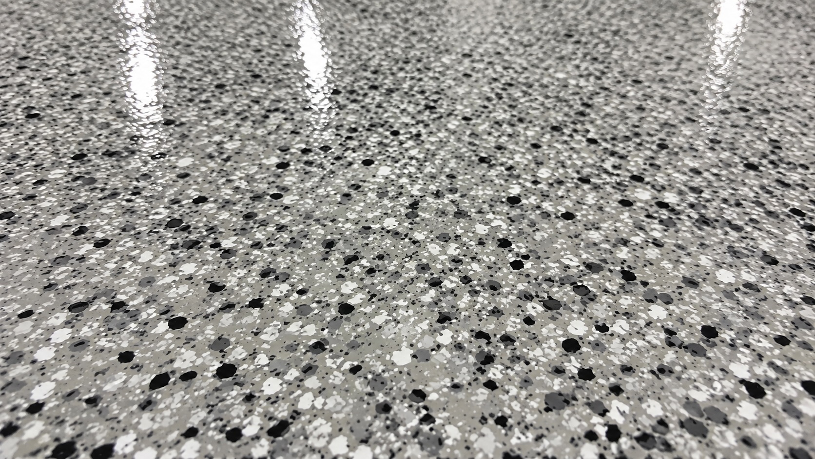 High-gloss polyaspartic floor coating in a residential garage in Lehi, Utah